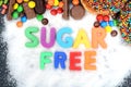 Health concept with multicolored letter blocks on white sugar spelling Ã¢â¬Åsugar freeÃ¢â¬Â